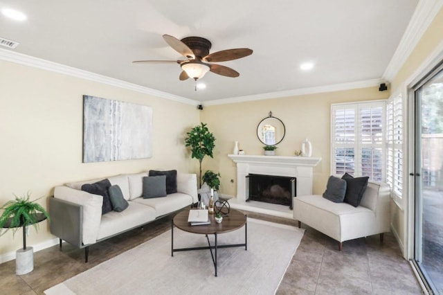 tiled living room featuring ceiling fan and ornamental molding