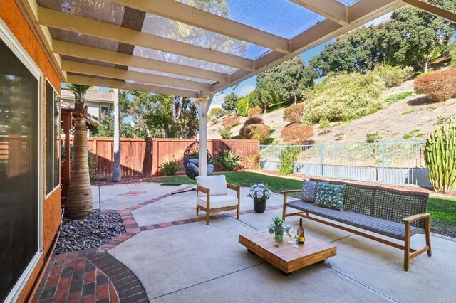 view of patio with a pergola and an outdoor hangout area