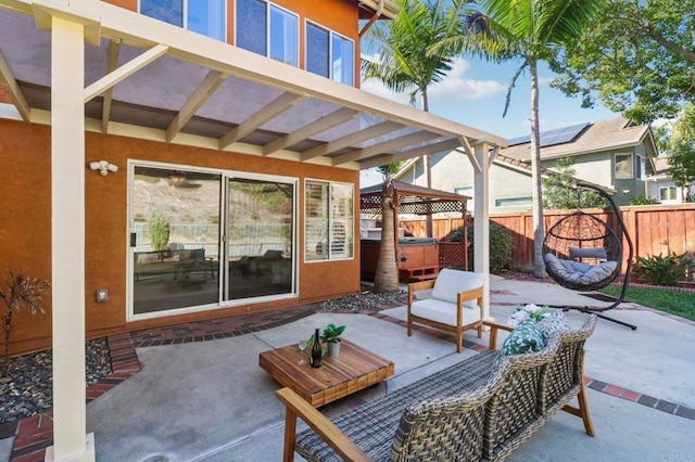 view of patio with outdoor lounge area, a pergola, and a hot tub