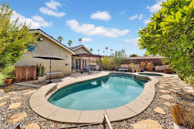 view of pool featuring an in ground hot tub and a patio