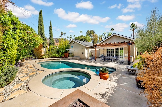 view of pool featuring an in ground hot tub and a patio