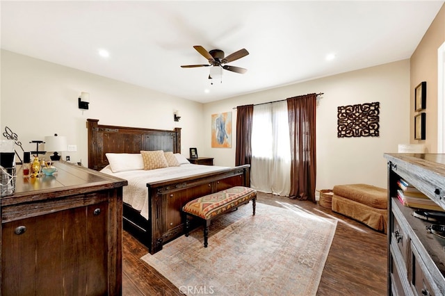 bedroom featuring dark hardwood / wood-style floors and ceiling fan