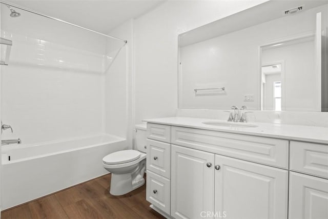 full bath with shower / tub combination, toilet, wood finished floors, visible vents, and vanity