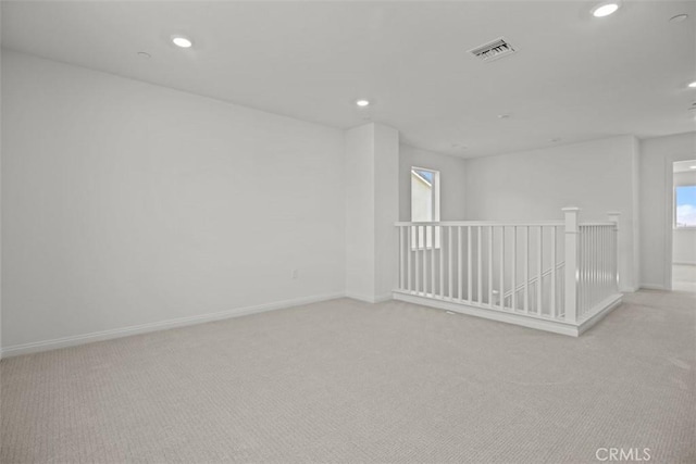 spare room with light carpet