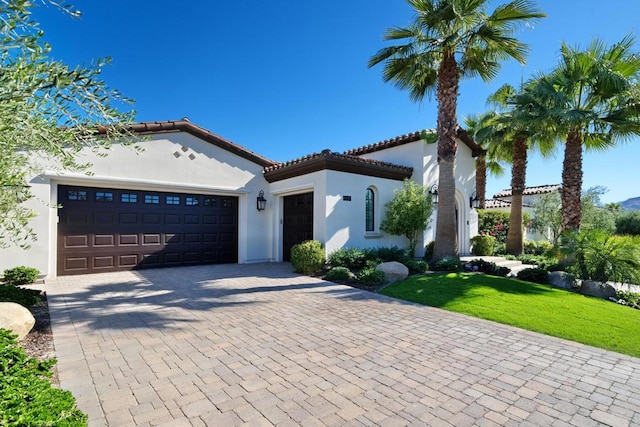 mediterranean / spanish-style house featuring a garage