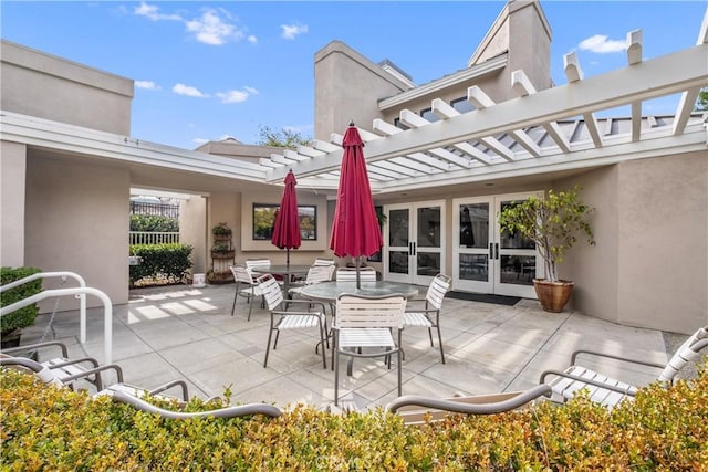 view of patio featuring french doors and a pergola