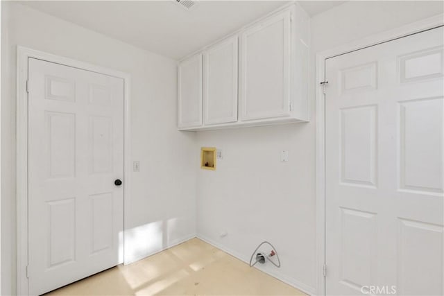 laundry area featuring gas dryer hookup, cabinets, and washer hookup