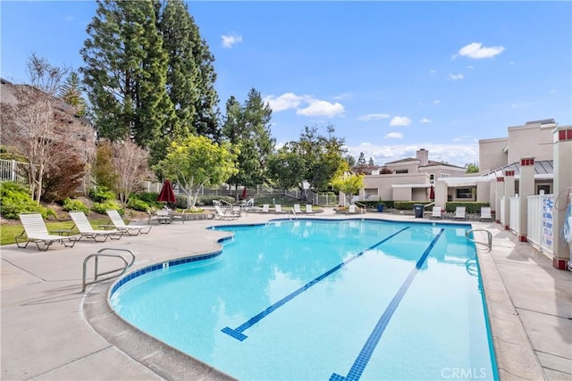 view of swimming pool with a patio area