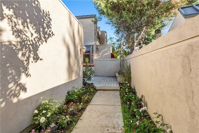 view of side of property featuring a patio area