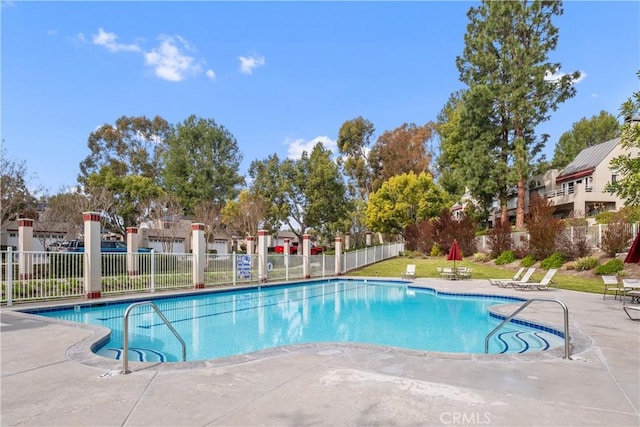 view of swimming pool featuring a patio area