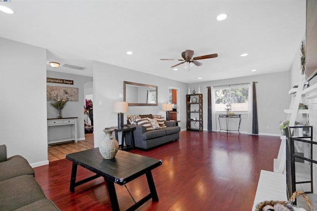 living room featuring wood-type flooring and ceiling fan