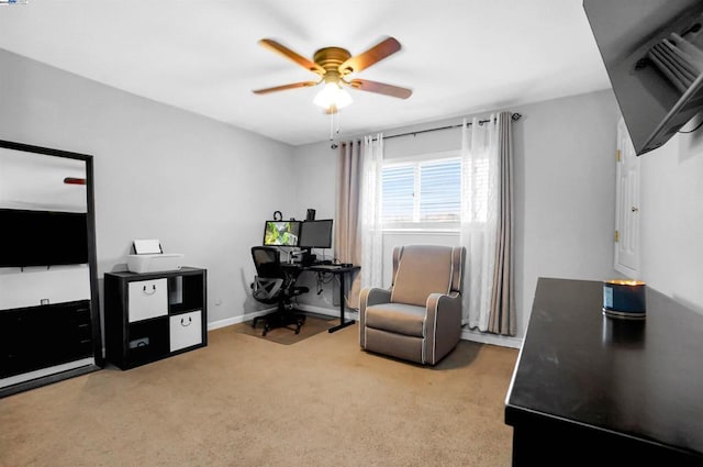 office area featuring light colored carpet and ceiling fan