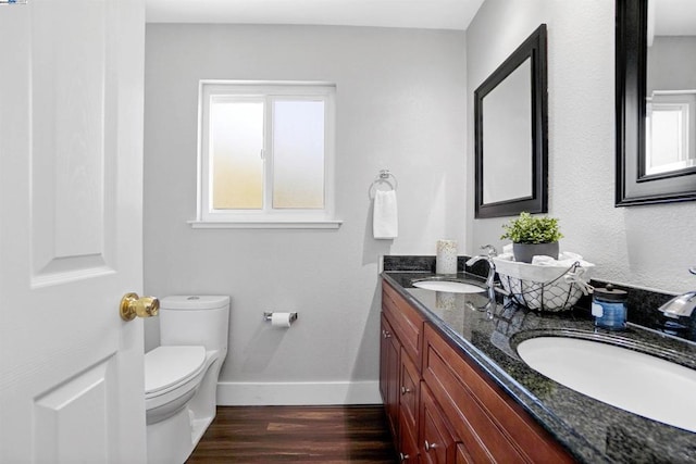 bathroom featuring hardwood / wood-style floors, vanity, and toilet