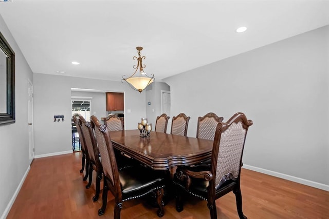 dining space with light hardwood / wood-style floors