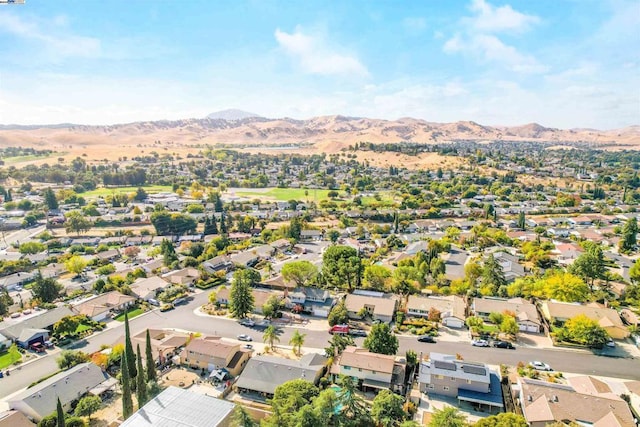 birds eye view of property with a mountain view