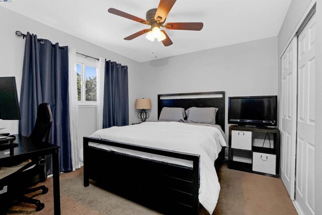 bedroom with ceiling fan and a closet