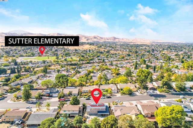 birds eye view of property featuring a mountain view