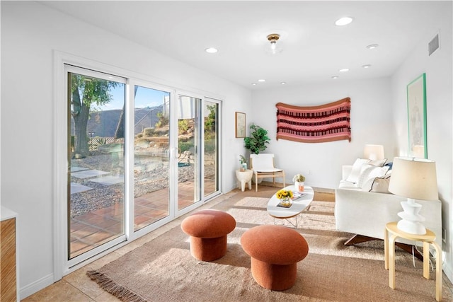 sitting room with tile patterned floors