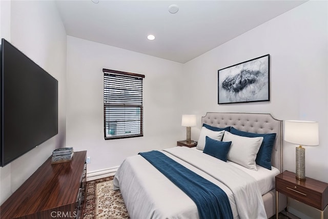 bedroom with wood-type flooring