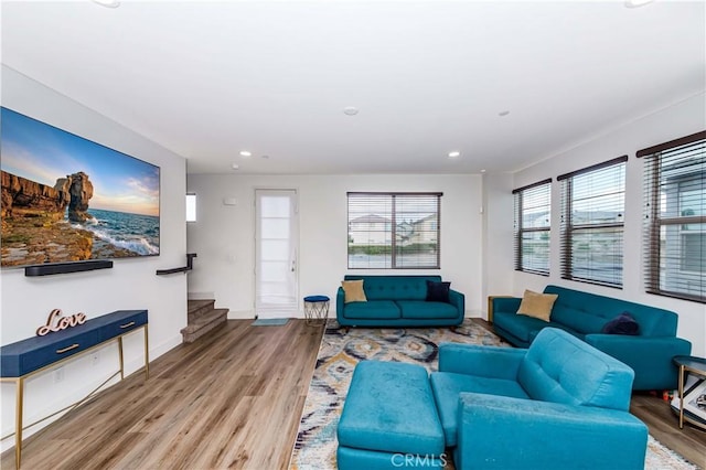 living room with hardwood / wood-style flooring and a healthy amount of sunlight