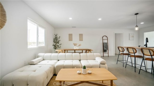 living room featuring concrete floors