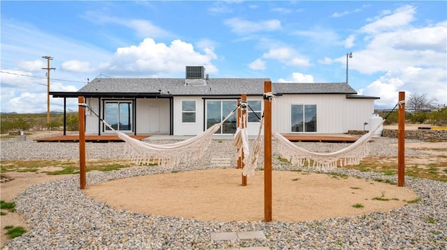 rear view of house with central AC