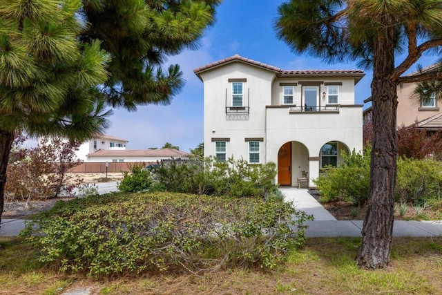 mediterranean / spanish home with a balcony