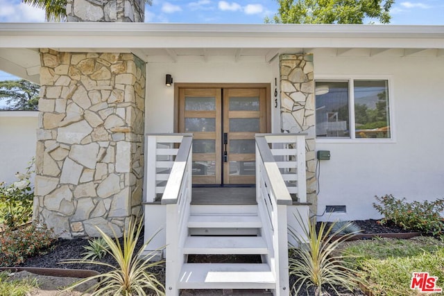 entrance to property with french doors