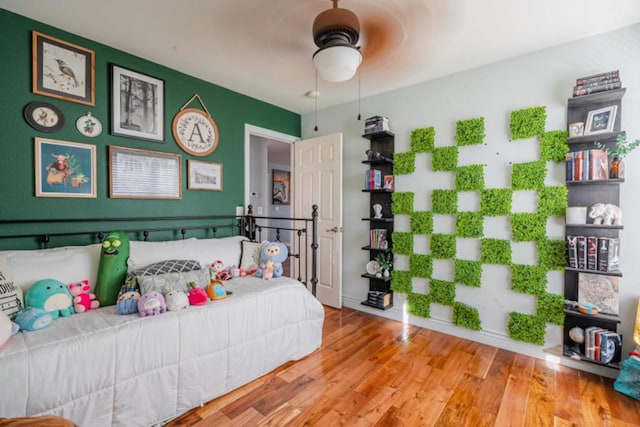 bedroom featuring ceiling fan and light hardwood / wood-style flooring