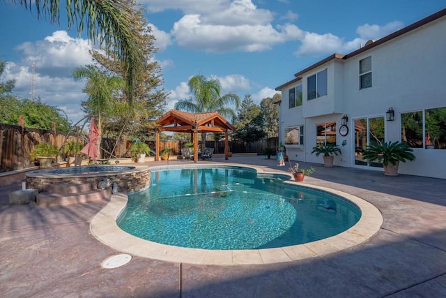 view of swimming pool with an in ground hot tub, a patio, and a gazebo