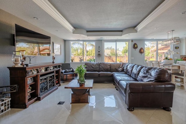 living room with crown molding, light tile patterned floors, a textured ceiling, and a tray ceiling