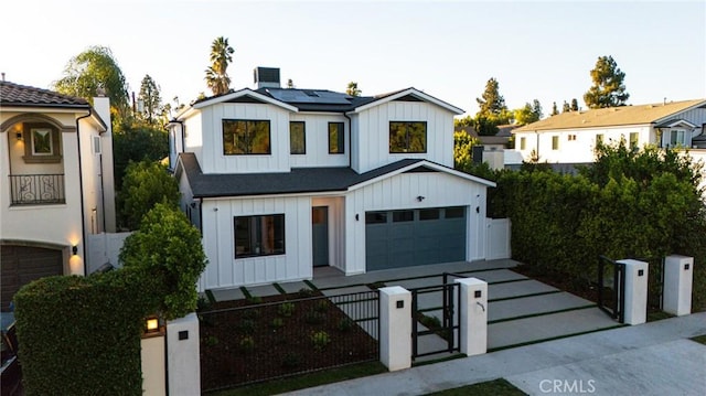 modern inspired farmhouse featuring solar panels and a garage