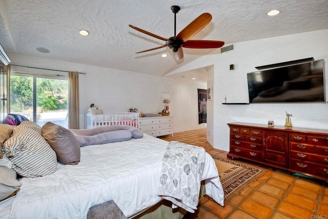 tiled bedroom featuring ceiling fan, access to exterior, lofted ceiling, and a textured ceiling