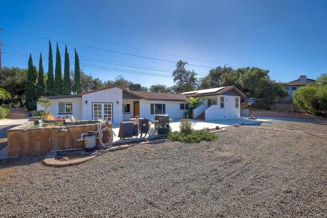 rear view of house with a patio area