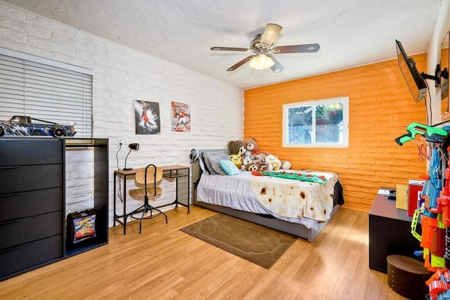 bedroom featuring light hardwood / wood-style flooring and ceiling fan