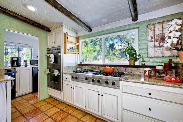 kitchen with beam ceiling, white cabinetry, a textured ceiling, and appliances with stainless steel finishes