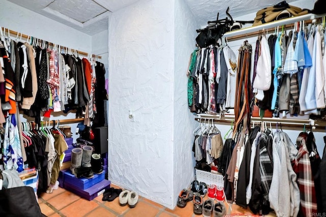 walk in closet featuring tile patterned flooring