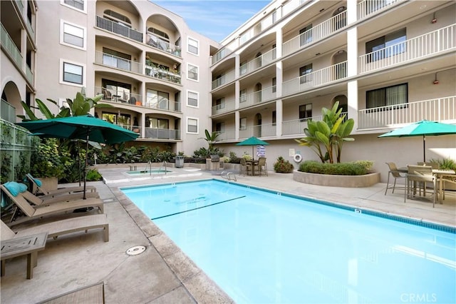 view of swimming pool featuring a patio area