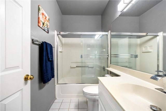 full bathroom with tile patterned floors, vanity, toilet, and shower / bath combination with glass door