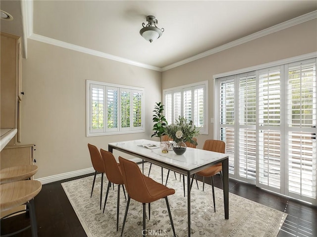 dining room with dark hardwood / wood-style flooring and ornamental molding