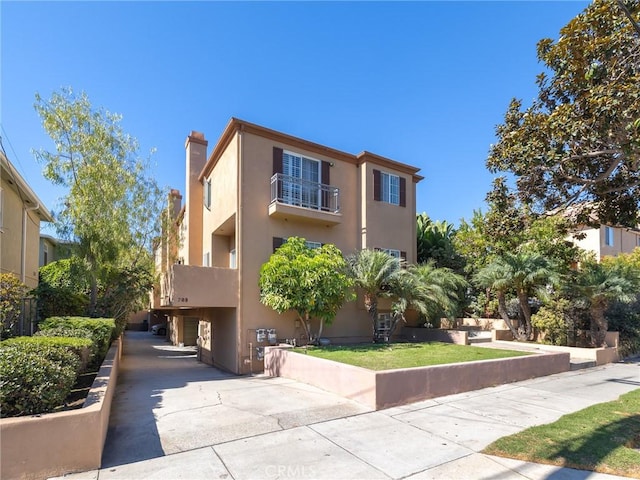 view of property exterior with a balcony