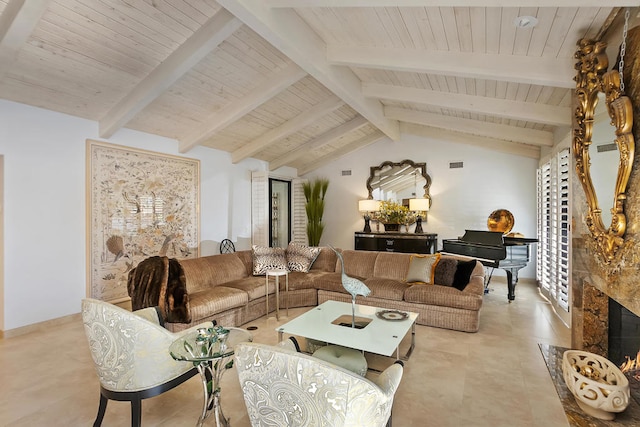 living room with vaulted ceiling with beams, a wealth of natural light, and a high end fireplace