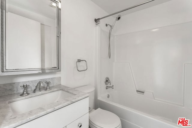 full bathroom with shower / bathing tub combination, vanity, and toilet