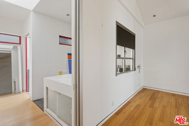 hallway with light wood-type flooring