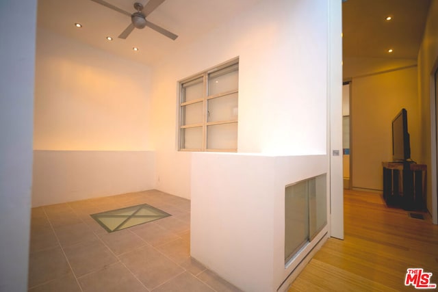 hallway featuring wood-type flooring