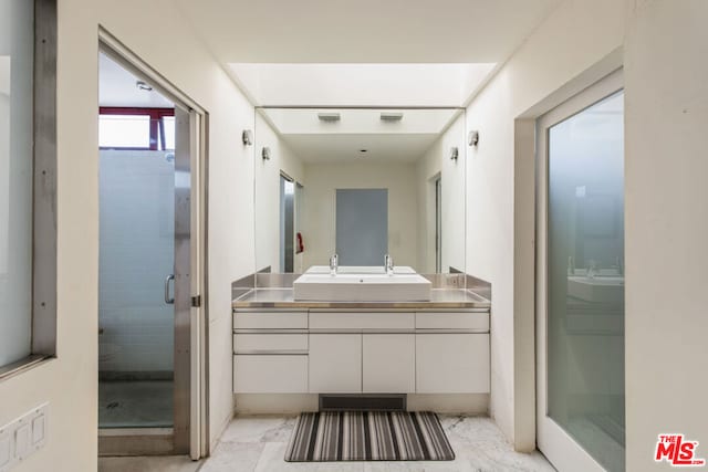 bathroom with vanity and walk in shower