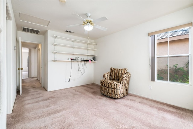 unfurnished room with ceiling fan and light colored carpet