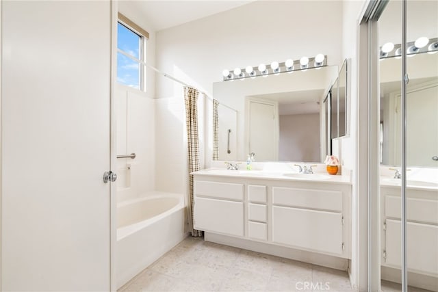 bathroom with vanity and shower / bathtub combination