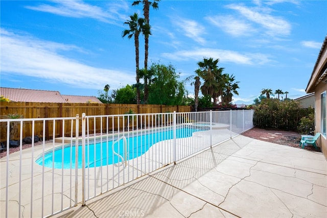 view of swimming pool featuring a patio area