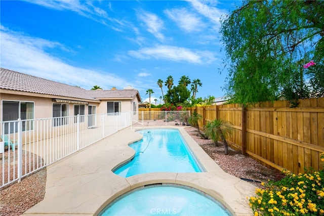 view of pool featuring a hot tub